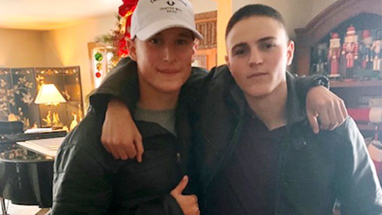 This Dec. 2019, photo provided by Regi Stone shows Eli Stone, left, and Rylee McCollum, at Christmas in Stone???s house in Jackson, Wyo. Rylee McCollum, of Bondurant, Wyo., was one of the U.S. Marines killed in the suicide bombing at the Kabul airport, in Afghanistan, according to his sister, Roice McCollum. (Regi Stone via AP)
