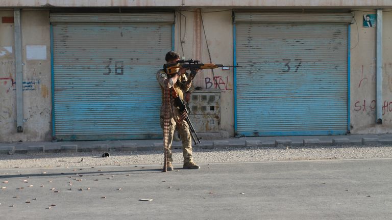 An Afghan security personnel take a position during fighting between Taliban and Afghan security forces in Herat province. Pic: AP
