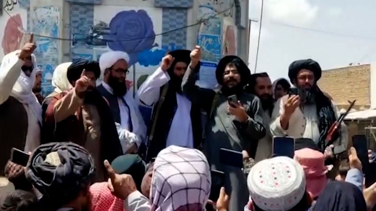 Taliban fighters celebrate as they take over another provincial capital after the US withdrawal