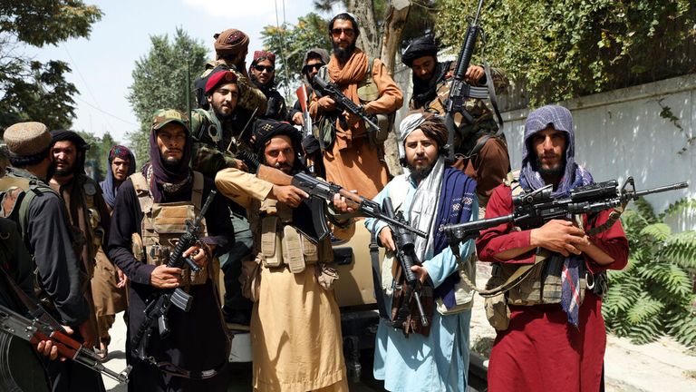 Taliban fighters pose for a photograph in Kabul, Afghanistan