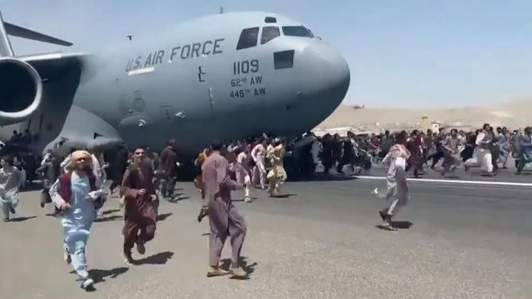 Afghanistan residents cling to plane in desperate bid to leave Taliban-controlled Kabul.