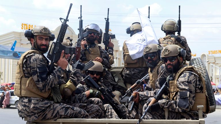 Taliban special force fighters arrive inside the Hamid Karzai International Airport. Pic: AP