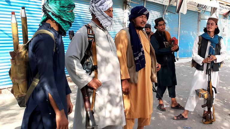 Taliban fighters stand guard in Kunduz after taking control of much of the northern Afghan city on Monday. Pic: AP