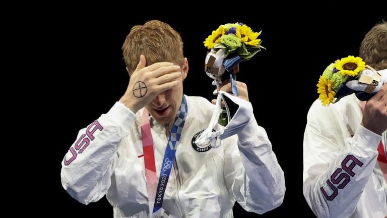 US fencer Race Imboden (L) with a cross on his right hand