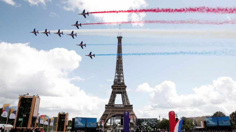 Alpha jets from the French Air Force Patrouille de France fly past Eiffel Tower at Paris&#39; Olympics fan zone during the closing ceremony of the Tokyo games, at Trocadero Gardens in Paris, France, August 8, 2021. REUTERS/Benoit Tessier