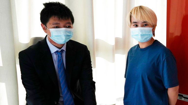 Ms Wu, pictured here with Mr Jingyu, left, claims she was abducted from a hotel in Dubai. Pic: AP