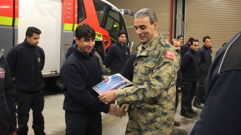 Ziaullah Omar (front left) served as a firefighter for the British at Kabul airport