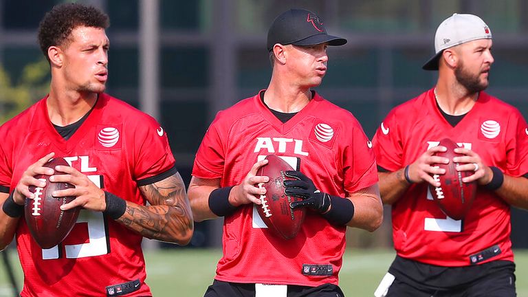 Flowery Branch: Atlanta Falcons quarterbacks Feleipe Franks (from left), Matt Ryan, and AJ McCarron look to pass while running a drill on the third day of training camp practice on Saturday, July 31, 2021, in Flowery Branch.   ...Curtis Compton / Curtis.Compton@ajc.com...