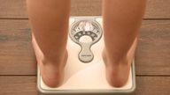 Embargoed to 0001 Tuesday October 11 Picture posed by model File photo dated 03/03/14 of an 11 year old girl using a set of weighing scales as more than 1.6 million children who started secondary school in the past decade were overweight or obese, new calculations show.
