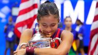 Emma Raducanu of Great Britain celebrates with the championship trophy after her match against Leylah Fernandez of Canada