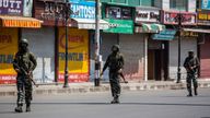 Indian paramilitary soldiers patrol a deserted market area in Srinagar, Indian controlled Kashmir. Pic: AP