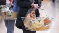 Undated file photo of a woman shopping holding a basket. Issued 1/9/2021