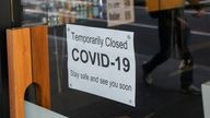 A sign is posted in a window during a lockdown to curb the spread of COVID in Sydney