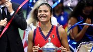 Emma Raducanu poses with the US Open trophy after her historic win