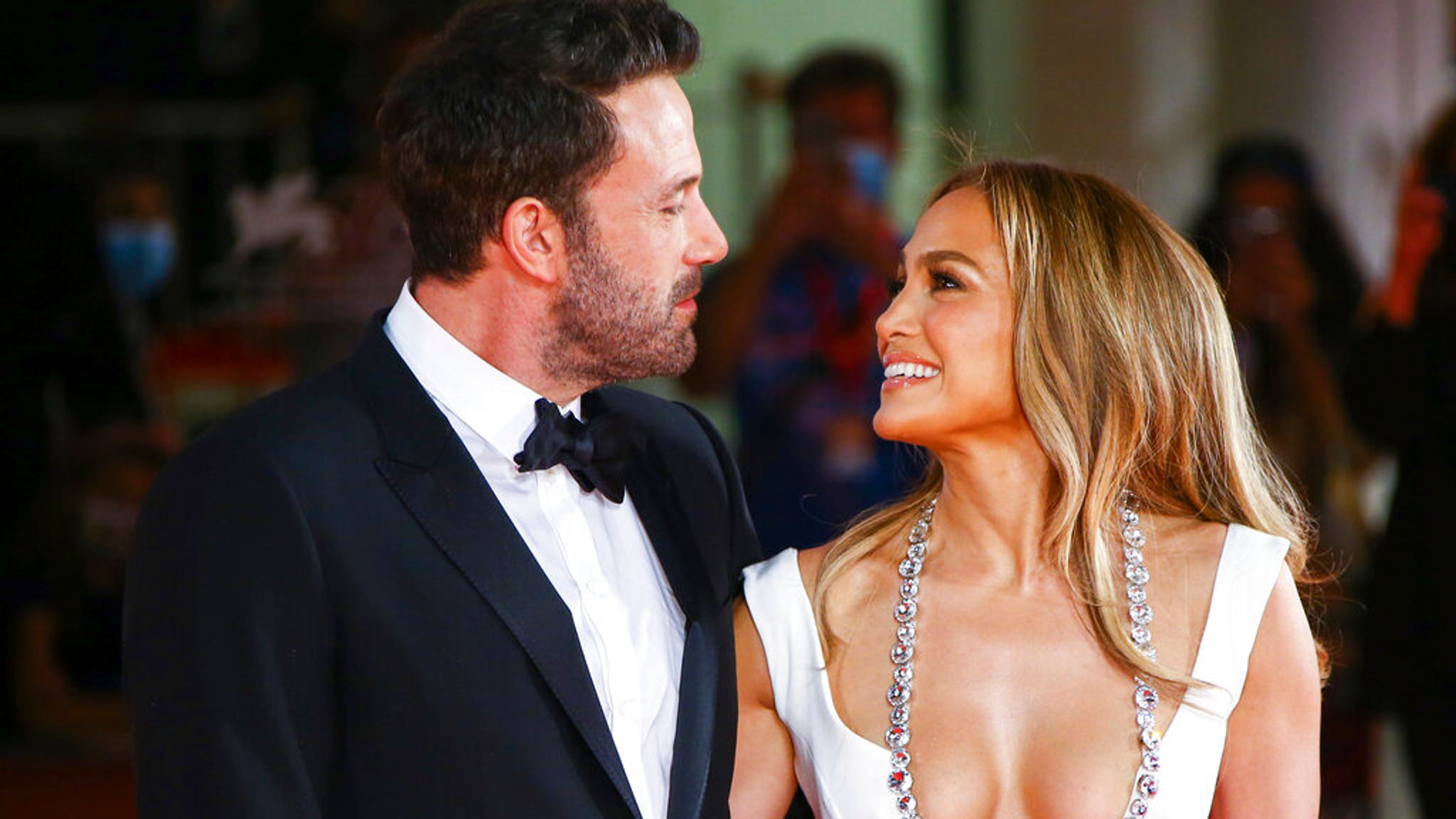 Jennifer Lopez and Ben Affleck share kiss as they make their first red