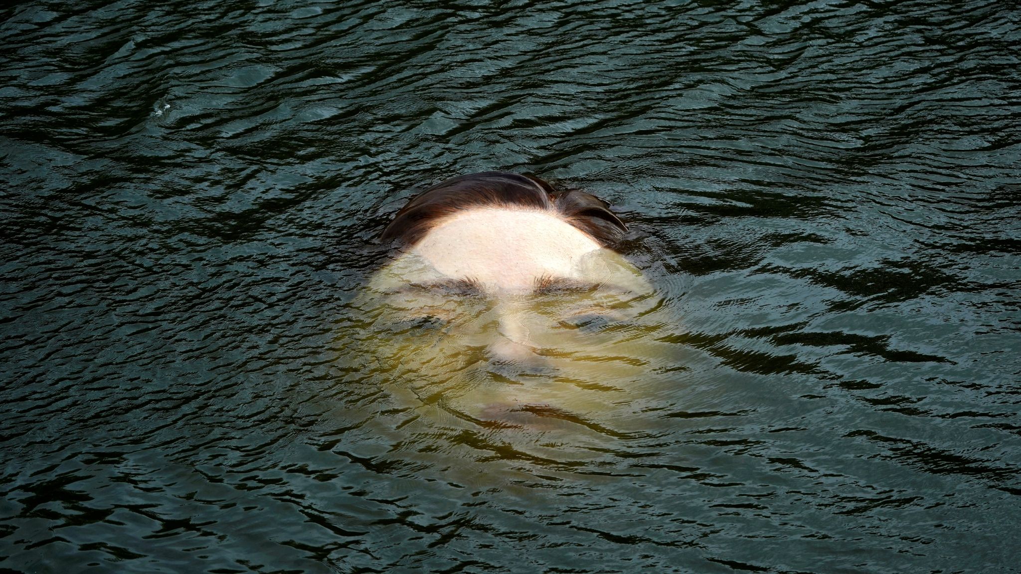 Eerie drowning girl statue in Bilbao river aims to encourage debate