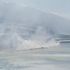 La Palma volcano: Acid-flecked plumes of steam rise as lava reaches the sea