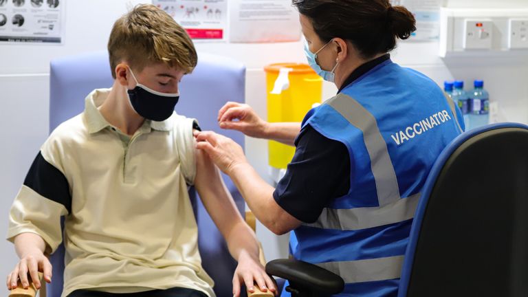 Kevin Mckeon, 14, receives his first dose of the Covid-19 vaccine from vaccinator Geraldine Flynn at the Citywest vaccination centre in Dublin. Vaccinations of children and teenagers is underway across Ireland, with more than 23 percent of those aged 12 to 15 registered to receive the jab. Picture date: Saturday August 14, 2021.