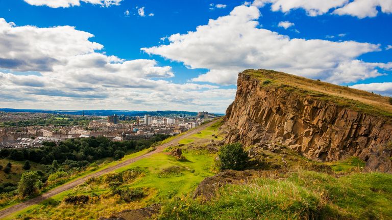 High above the city of Edinburgh loom Salisbury Crags, part of a volcanic formation several million years old known as Arthurs Seat. The spot is popular with walkers and tourists.