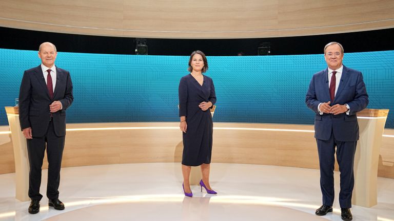 Chairwoman of Buendnis 90/Die Gruenen Annalena Baerbock, Prime Minister of North Rhine-Westphalia (NRW) and leader of the Christian Democratic Union (CDU) Armin Laschet and German Finance Minister and Social Democratic Party candidate Olaf Scholz are pictured before a televised debate of the candidates to succeed Angela Merkel as German chancellor in Berlin, Germany, September 12, 2021. Michael Kappeler/Pool via REUTERS