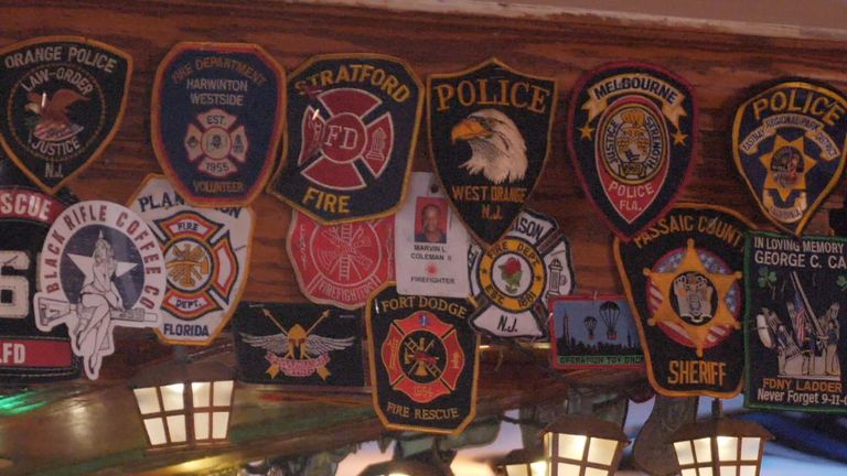 Inside this New York pub, the walls are covered with the badges of the first responders
