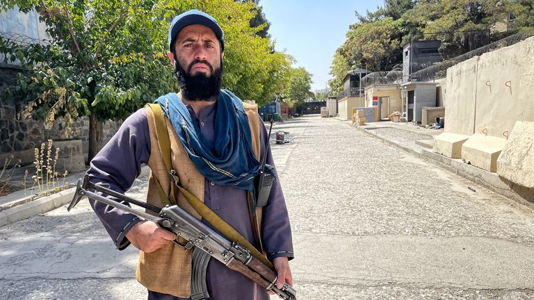 A Taliban militant guards the British embassy