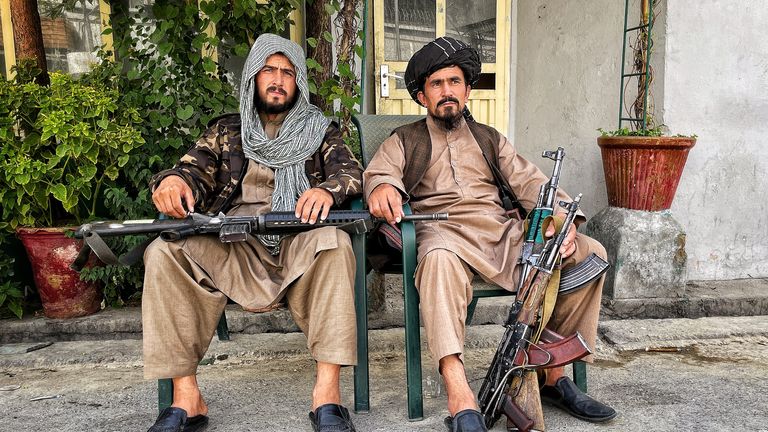 A pair of Taliban fighters with weapons