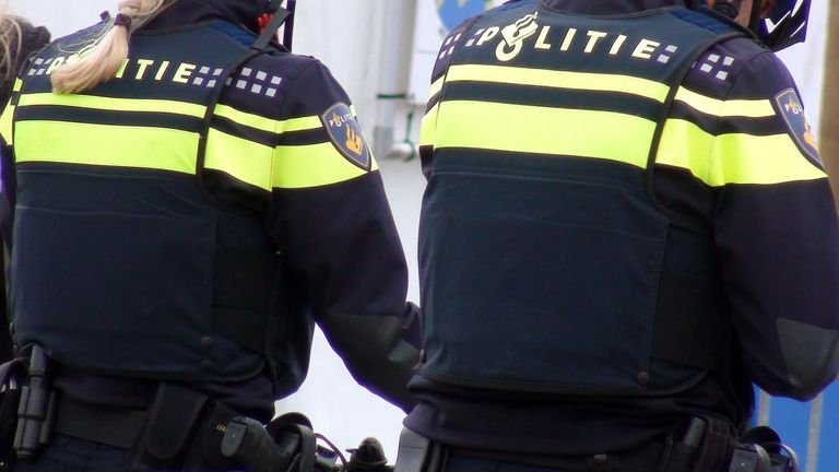 Scene Of Two Dutch Police Officers In Police Uniform On The Street Of The Hague South Holland The Netherlands Europe. Pic: iStock   