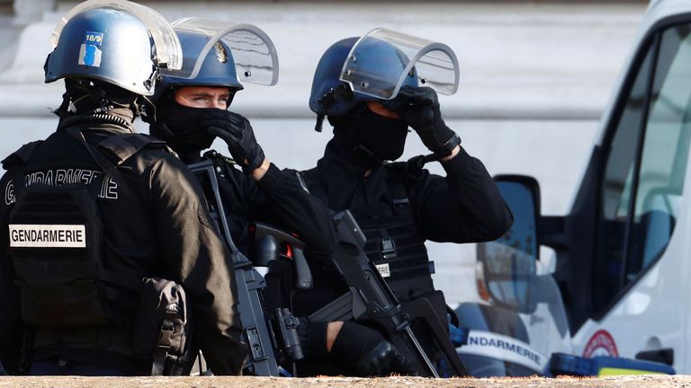 French Gendarmes secure near the Paris courthouse on the Ile de la Cite France during the arrival of a convoy believed to be carrying the defendants who stand trial over Paris&#39; November 2015 attacks, in Paris