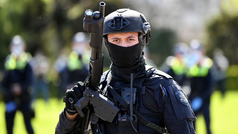 Riot police respond to protesters rallying against construction industry COVID-19 mandates in Melbourne