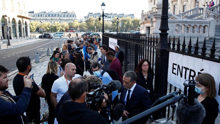 Journalists line up to enter the Paris courthouse on the Ile de la Cite before the start of the trial of the Paris&#39; November 2015 attacks, in Paris, France, September 8, 2021