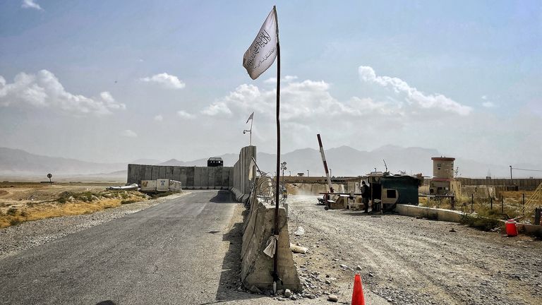 The Taliban flag flies on a checkpoint at the entrance to Bagram