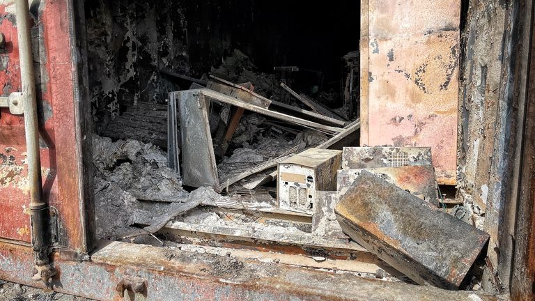 Burned out hard drives and documents are seen at the facility