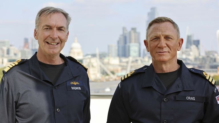 Ministry of Defence handout image of actor Daniel Craig (right), best known for playing the role of James Bond in the long-running 007 film series, wearing the honorary Royal Navy rank of Commander he has received from the Head of the Royal Navy, First Sea Lord Admiral Sir Tony Radakin (left), at the Corinthia Hotel.  
Pic:LPhot Lee Blease/PA