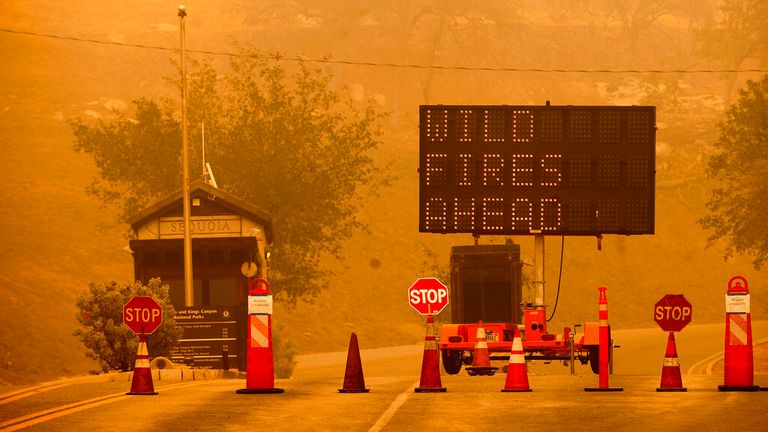 Cones block the entrance to Sequoia National Park as the KNP Complex Fire burns nearby on Wednesday. Pic: AP