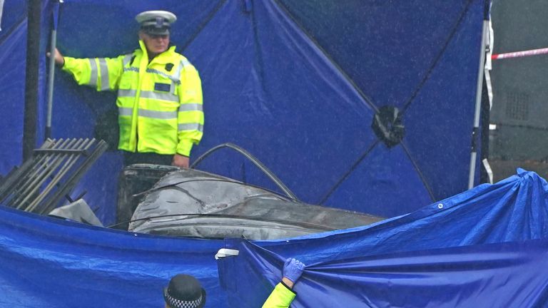 Emergency services at the scene on the Great Western Road, Notting Hill, west London, where three people have died after a vehicle collided with a residential block