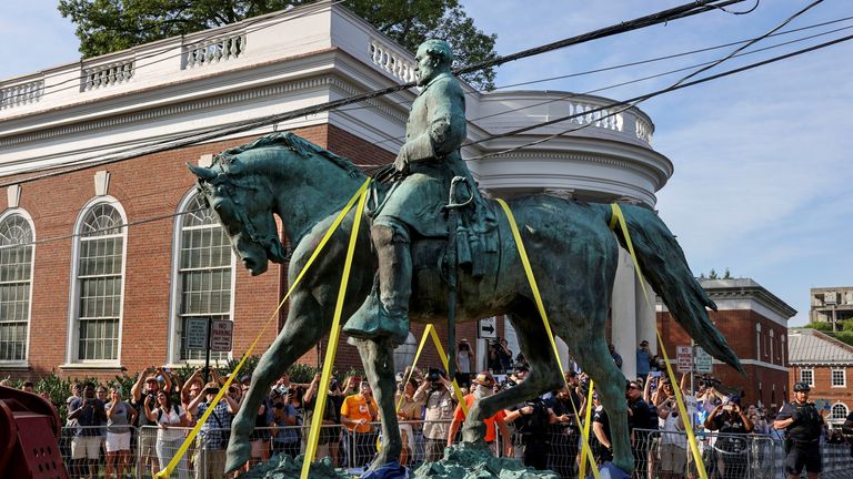 A statue of Confederate General Robert E. Lee is removed after years of a legal battle over the contentious monument, in Charlottesville, Virginia, the U.S, July 10, 2021. REUTERS/Evelyn Hockstein TPX IMAGES OF THE DAY