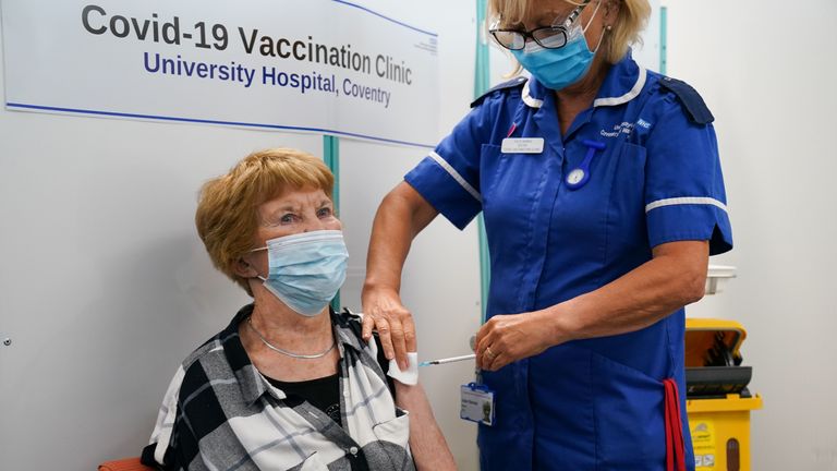 Margaret Keenan, the first person to receive the coronavirus vaccine in December last year, receives her booster jab at University Hospital Coventry, Warwickshire