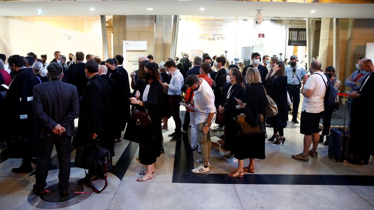 People arrive for the start of the trial of the Paris&#39; November 2015 attacks at the Paris courthouse on the Ile de la Cite, in Paris, France, September 8, 2021. Twenty defendants stand trial over Paris&#39; November 2015 attacks from September 8, 2021 to May 25, 2022, with nearly 1,800 civil parties, more than 300 lawyers, hundreds of journalists and large-scale security challenges. REUTERS/Gonzalo Fuentes