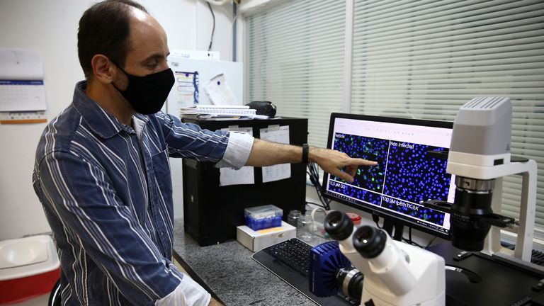  researcher works on a sample inside a laboratory at the University of Sao Paulo&#39;s Institute of Physics for a study in which the institute claims to have discovered a 75% drop in the coronavirus disease (COVID-19) production after cells came into contact with jararacussu snake venom, in Sao Carlos, Brazil August 30, 2021. Picture taken August 30, 2021. REUTERS/Carla Carniel