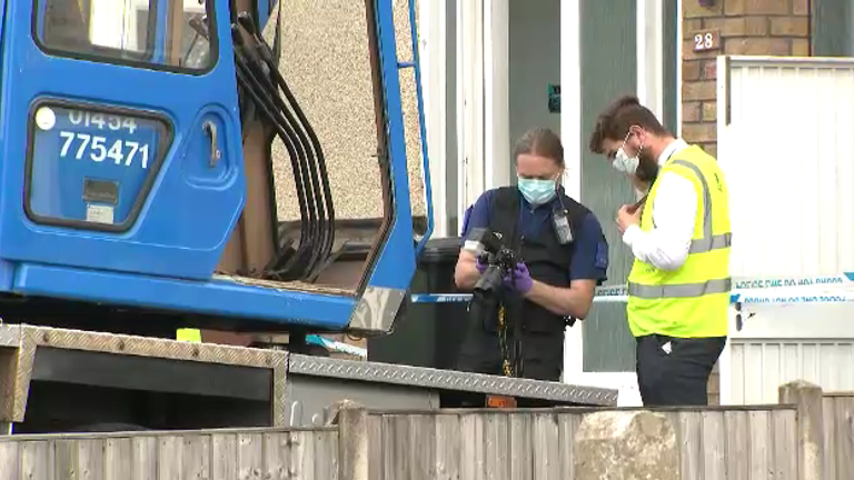 Police at the scene where a man died after a heavy load fell from a crane
