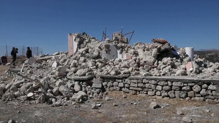 Damaged buildings and rubble in Crete, Greece.