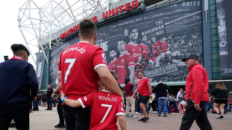 Fans wearing Ronaldo shirts outside Old Trafford. Pic: AP