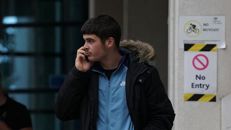 Alfie Chandler, 18, leaves Kingston Crown Court, south west London.