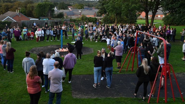 Members of the public attend a vigil at the scene in Chandos Crescent, Killamarsh, near Sheffield