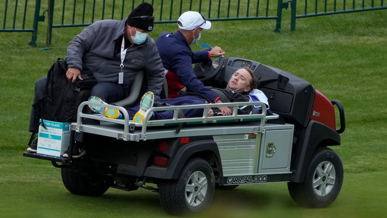 Actor Tom Felton is helped after collapsing on the 18th hole during a practice day at the Ryder Cup at the Whistling Straits Golf Course Thursday, Sept. 23, 2021, in Sheboygan, Wis. Pic: AP