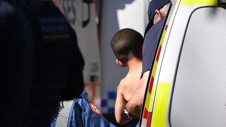 Three-year-old AJ Elfalak is carried by a paramedic into an ambulance after he is found alive on the family property near Putty, north west of Sydney, Australia, Monday, Sept. 6, 2021. AJ was found sitting in a creek and cupping water in his hands to drink three days after he was lost in rugged Australian woodland. 
PIC:AAP /AP