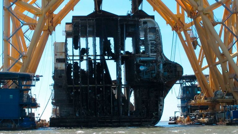  FILE - In this April 26, 2021 file photo, interior decks of the capsized cargo ship Golden Ray are exposed after the engine room section was cut away and separated from the rest of the shipwreck by a towering crane, offshore of St. Simons Island, Ga. Accounts contained in crew member interviews are among more than 1,700 pages of documents made public Thursday, July 29, by the National Transportation Safety Board. The Golden Ray, carrying more than 1,400 vehicles, o