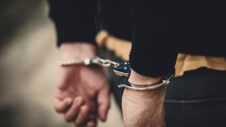 Man in handcuffs behind his back. Pic: iStock