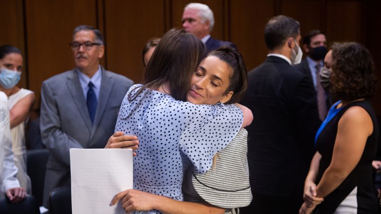 U.S. Olympic gymnast Aly Raisman embraces McKayla Maroney after testifying during a Senate Judiciary hearing about the Inspector General's report on the FBI handling of the Larry Nassar investigation of sexual abuse of Olympic gymnasts, on Capitol Hill, in Washington, D.C., U.S., September 15, 2021. Saul Loeb/Pool via REUTERS